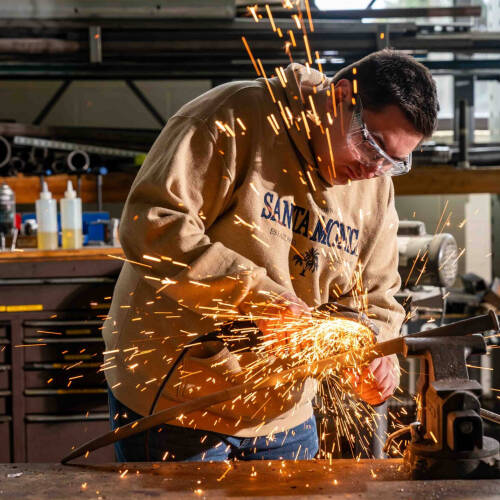 A PCE student works on a sword that is part of the Cast In Steel series
